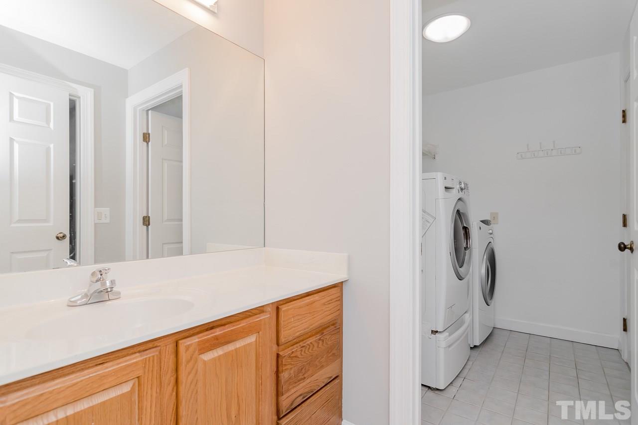 1404 Onslow Road Raleigh, NC 27606 - Photo 14 of 30 a bathroom with a sink vanity and a mirror