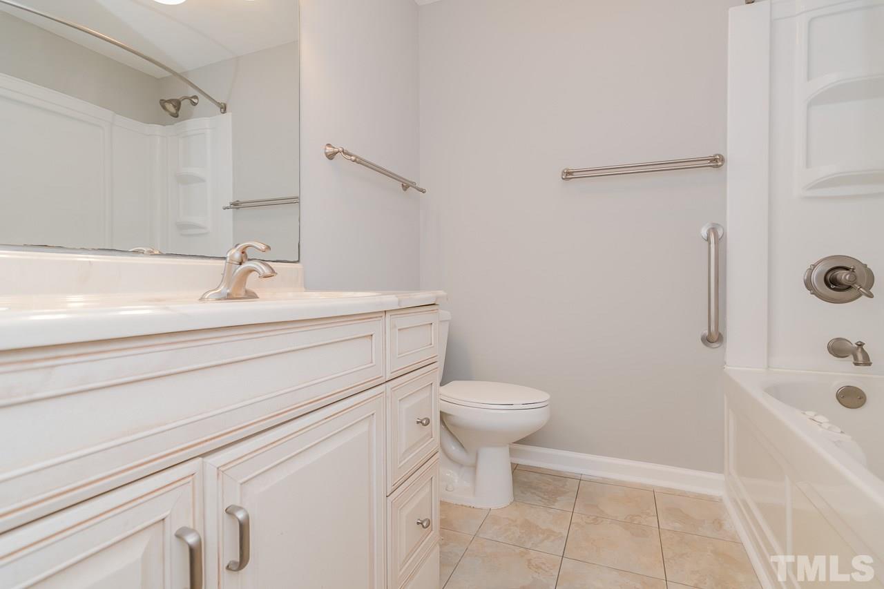 1404 Onslow Road Raleigh, NC 27606 - Photo 22 of 30 a bathroom with a sink toilet and shower