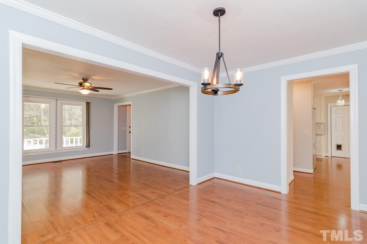 1404 Onslow Road Raleigh, NC 27606 - Photo 5 of 30 a view of an empty room with wooden floor and a window