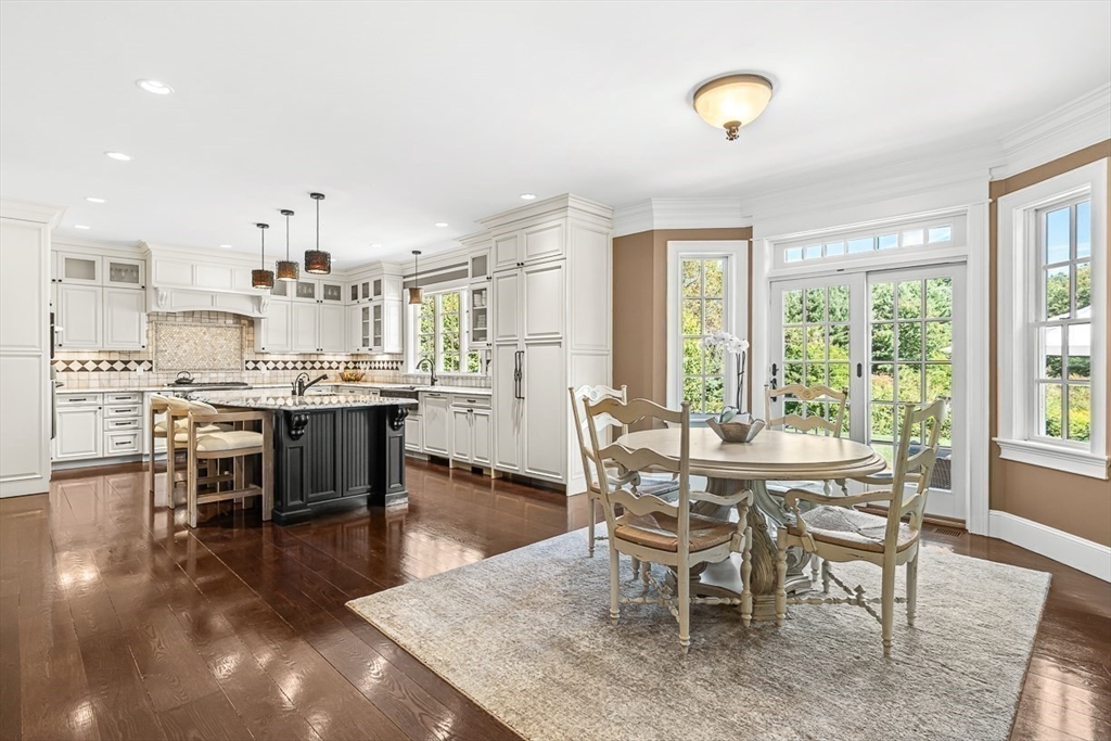 33 Old Concord Road Lincoln, MA 01773 - Photo 11 of 42 a view of a dining room and livingroom with furniture wooden floor and a rug