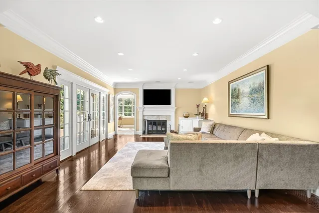 a living room with fireplace furniture and a flat screen tv