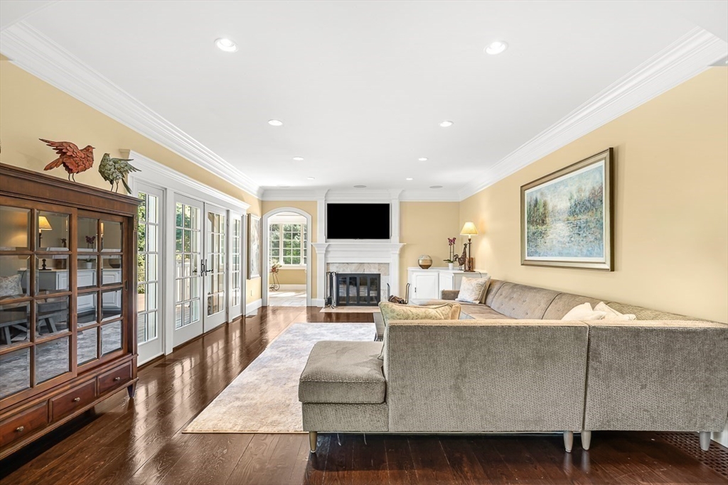 33 Old Concord Road Lincoln, MA 01773 - Photo 13 of 42 a living room with fireplace furniture and a flat screen tv