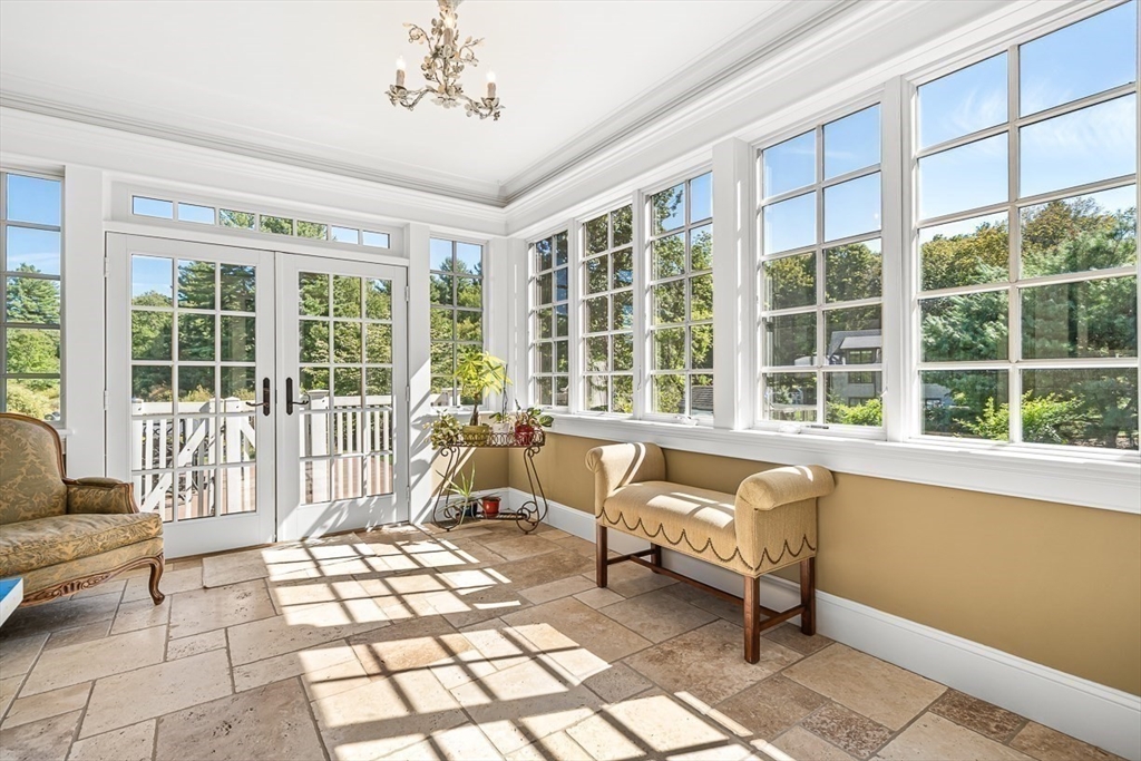 33 Old Concord Road Lincoln, MA 01773 - Photo 15 of 42 a living room with a large white couch next to a window