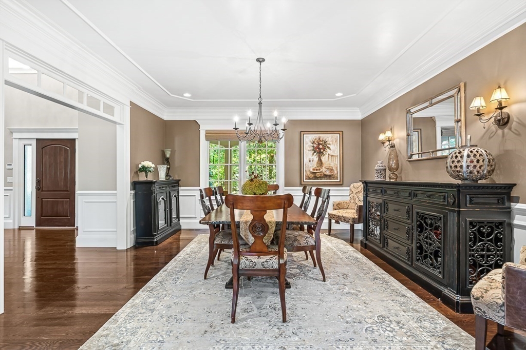 33 Old Concord Road Lincoln, MA 01773 - Photo 17 of 42 a dining room with furniture a chandelier and wooden floor