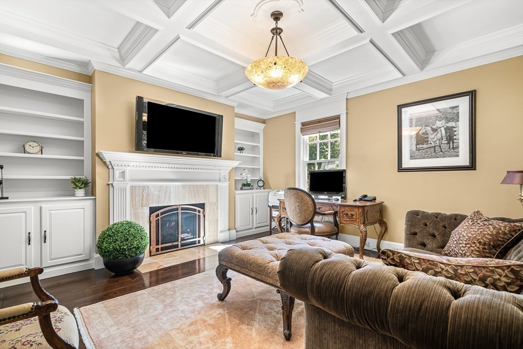 33 Old Concord Road Lincoln, MA 01773 - Photo 18 of 42 a living room with furniture a flat screen tv and a fireplace