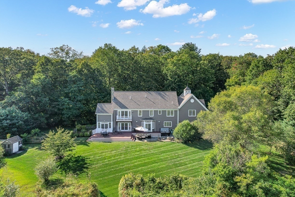 33 Old Concord Road Lincoln, MA 01773 - Photo 2 of 42 a view of a big house with a big yard plants and large trees
