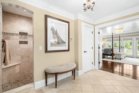 a view of a hallway with workspace and a mirror