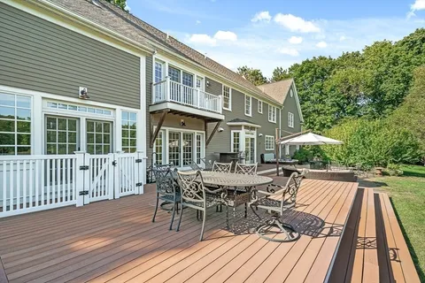 a view of a house with a patio and wooden flooring