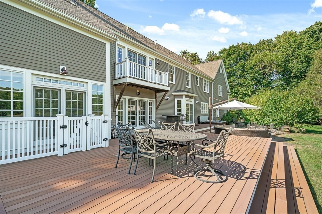 33 Old Concord Road Lincoln, MA 01773 - Photo 36 of 42 a view of a house with a patio and wooden flooring
