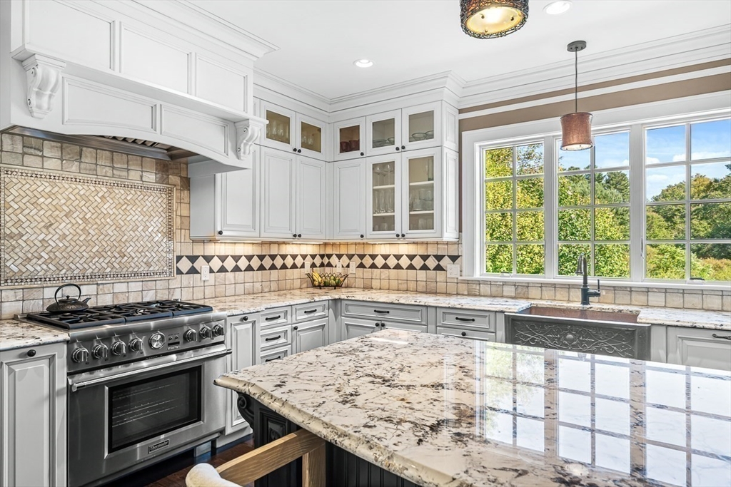 33 Old Concord Road Lincoln, MA 01773 - Photo 6 of 42 a kitchen with a stove a sink and a microwave