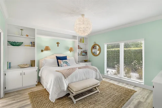 a bedroom with a bed and window