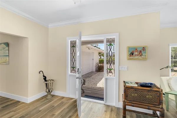a view of a hallway with workspace and bedroom