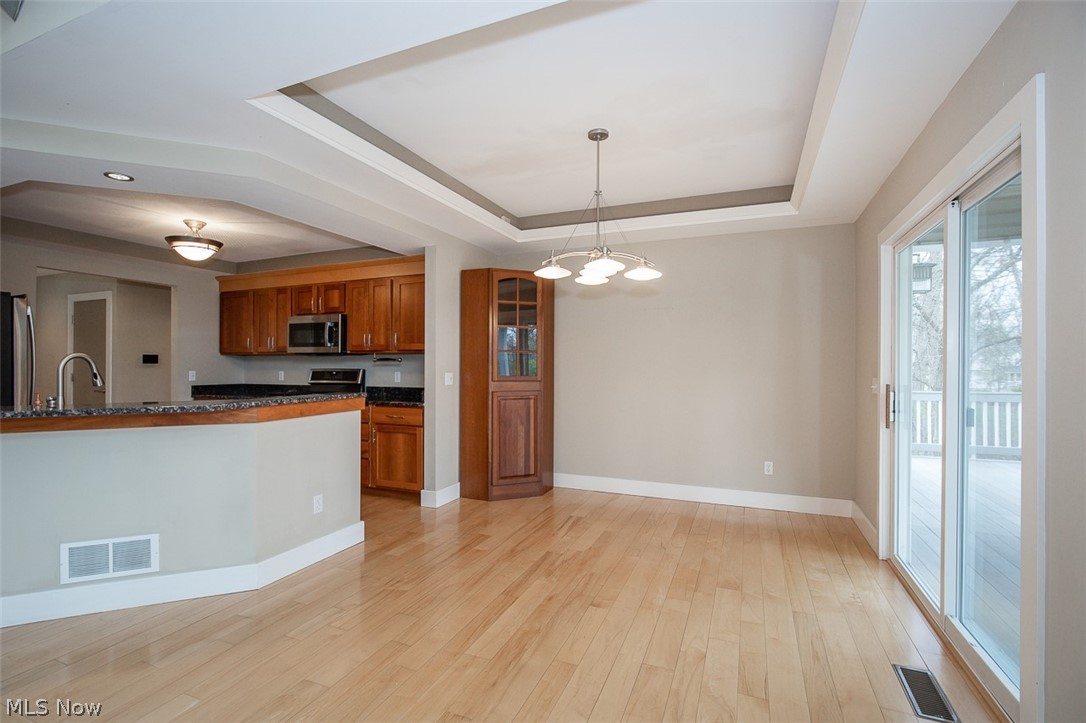 7282 Holzhauer Road Northfield, OH 44067 - Photo 8 of 47 Kitchen breakfast bar with granite counter top
