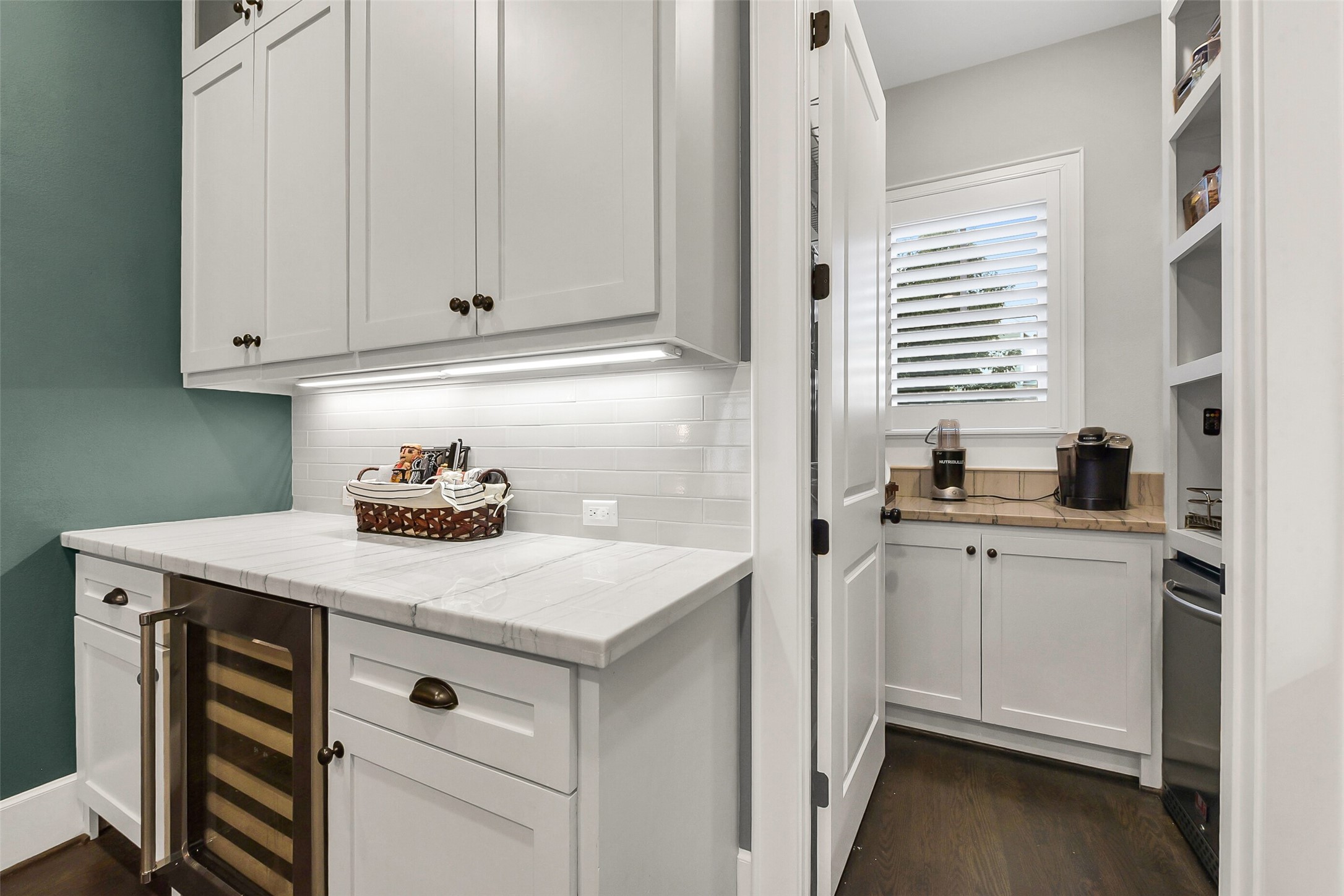 508 East 25th Street Houston, TX 77008 - Photo 11 of 45 The butlers pantry including a wine fridge and convenient under-cabinet lighting. Additional storage and refrigerator can be found in the walk-in pantry.