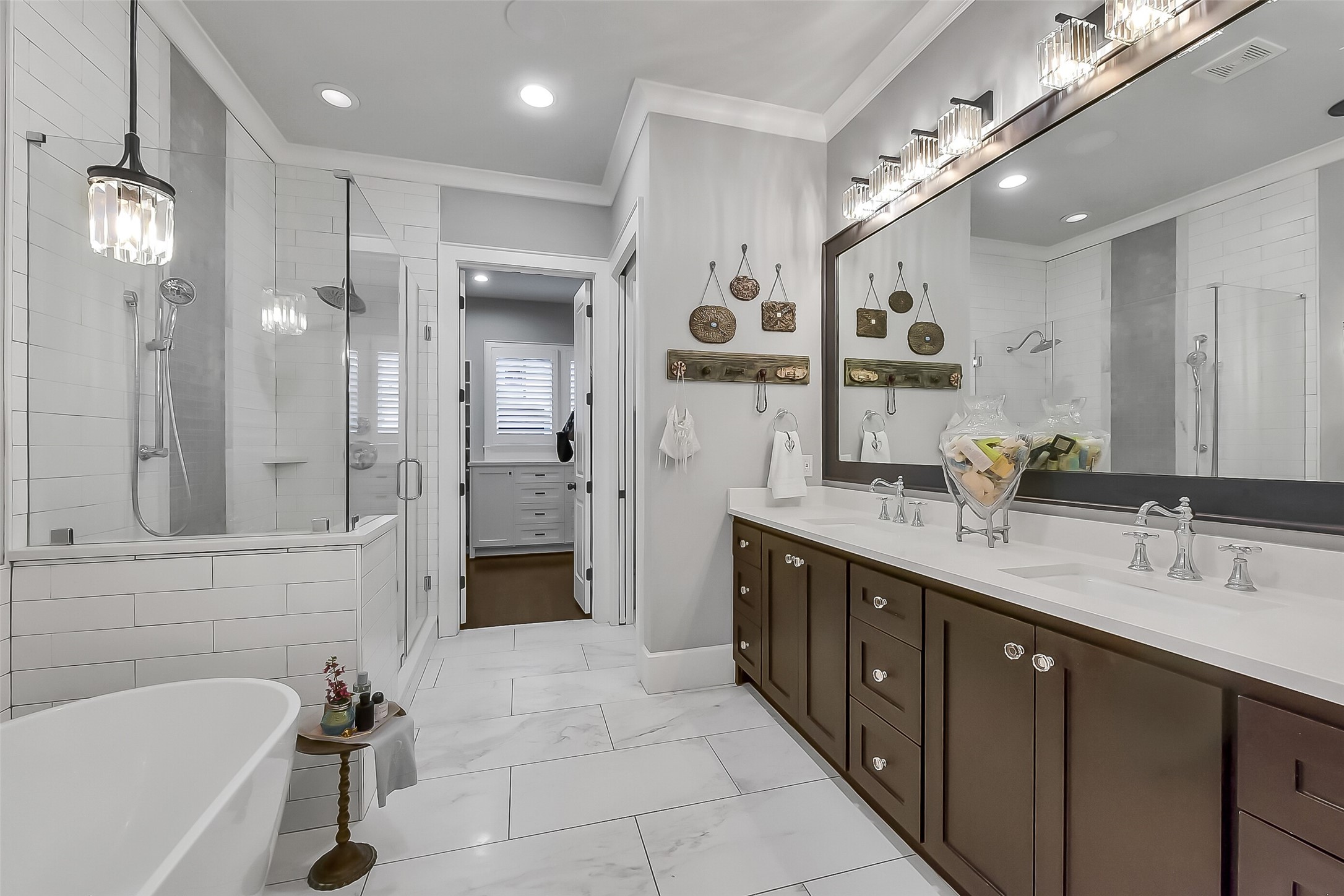 508 East 25th Street Houston, TX 77008 - Photo 14 of 45 Enjoy the luxurious primary bathroom including a walk-in shower, deep soaking tub, and double vanity. Within the closet you will find one of three sets of washers and dryers, a rare and extremely convenient commodity!