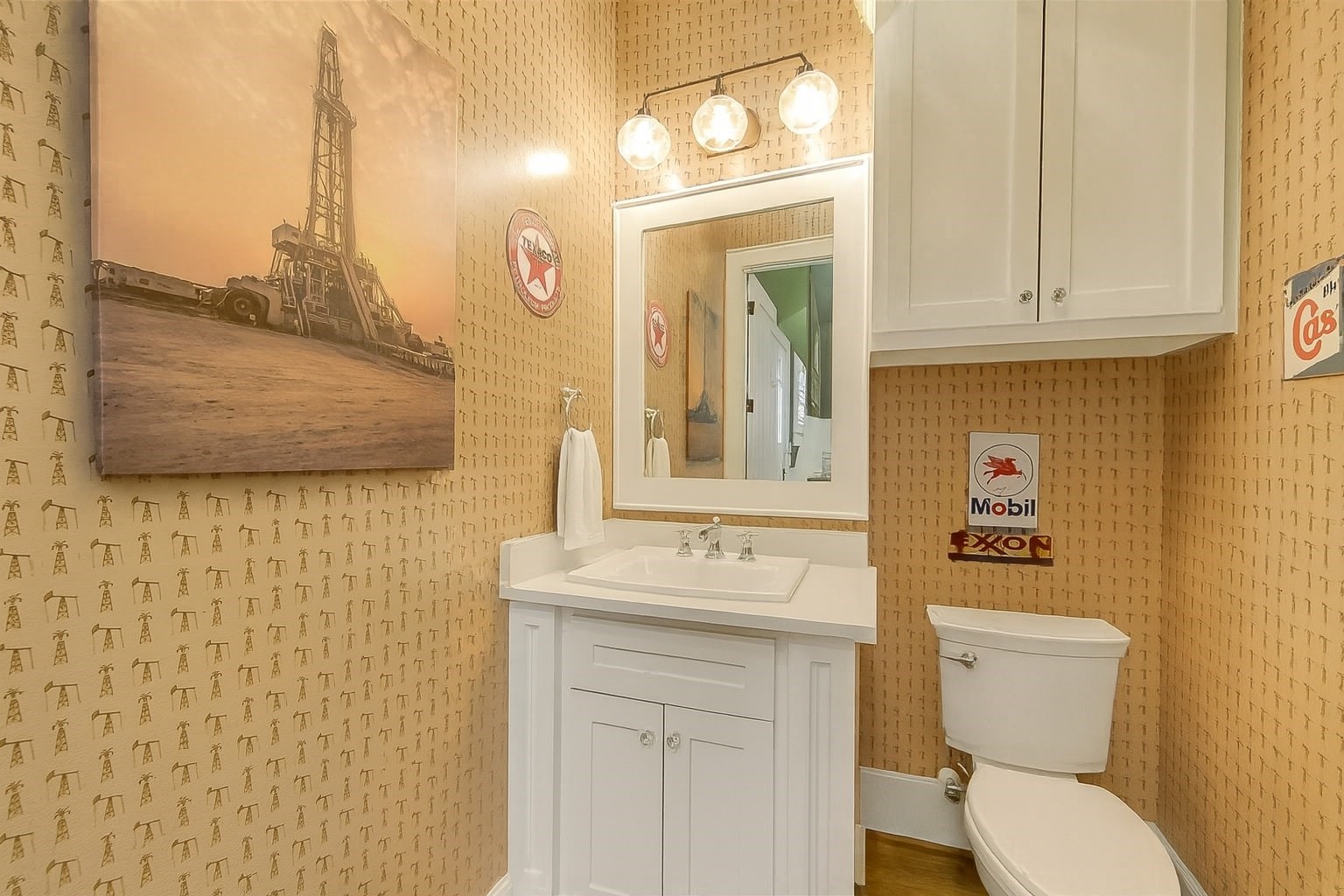 508 East 25th Street Houston, TX 77008 - Photo 37 of 45 Charming powder room equipped with white cabinetry.