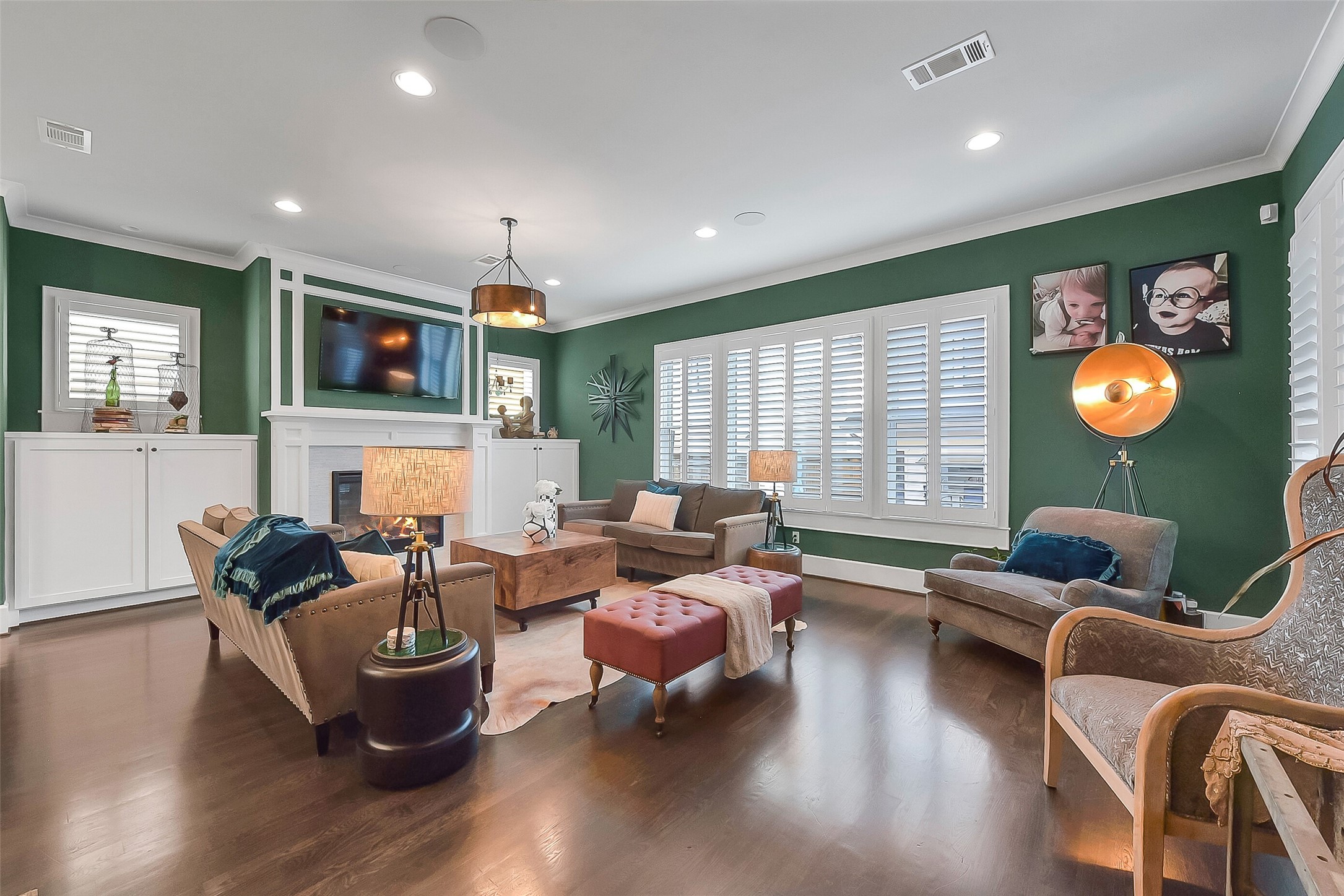 508 East 25th Street Houston, TX 77008 - Photo 5 of 45 The family room is anchored on one side by the gas log fireplace and custom built-ins. On the other side are French doors leading to the covered back patio.