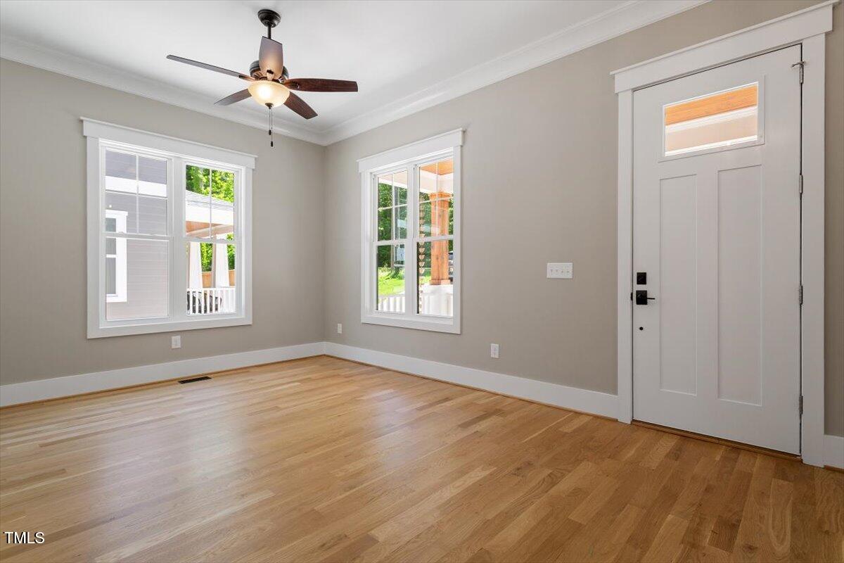 3934 Old Chapel Hill Road Durham, NC 27707 - Photo 12 of 47 a view of an empty room with window and wooden floor