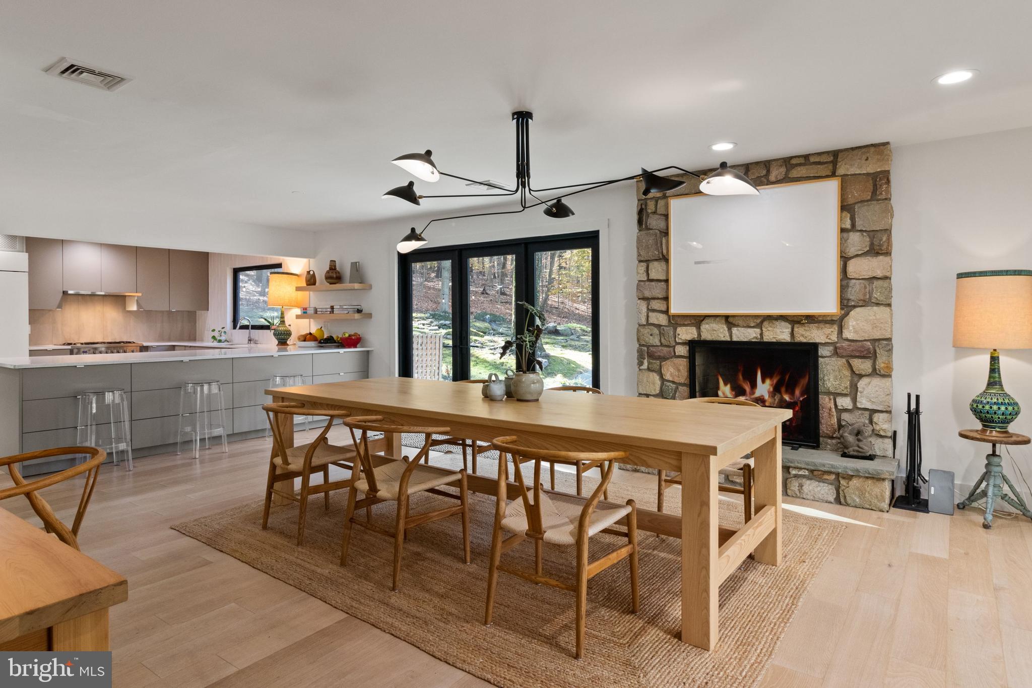 7036 Upper York Road New Hope, PA 18938 - Photo 7 of 45 Dining Area with Fireplace open to Kitchen