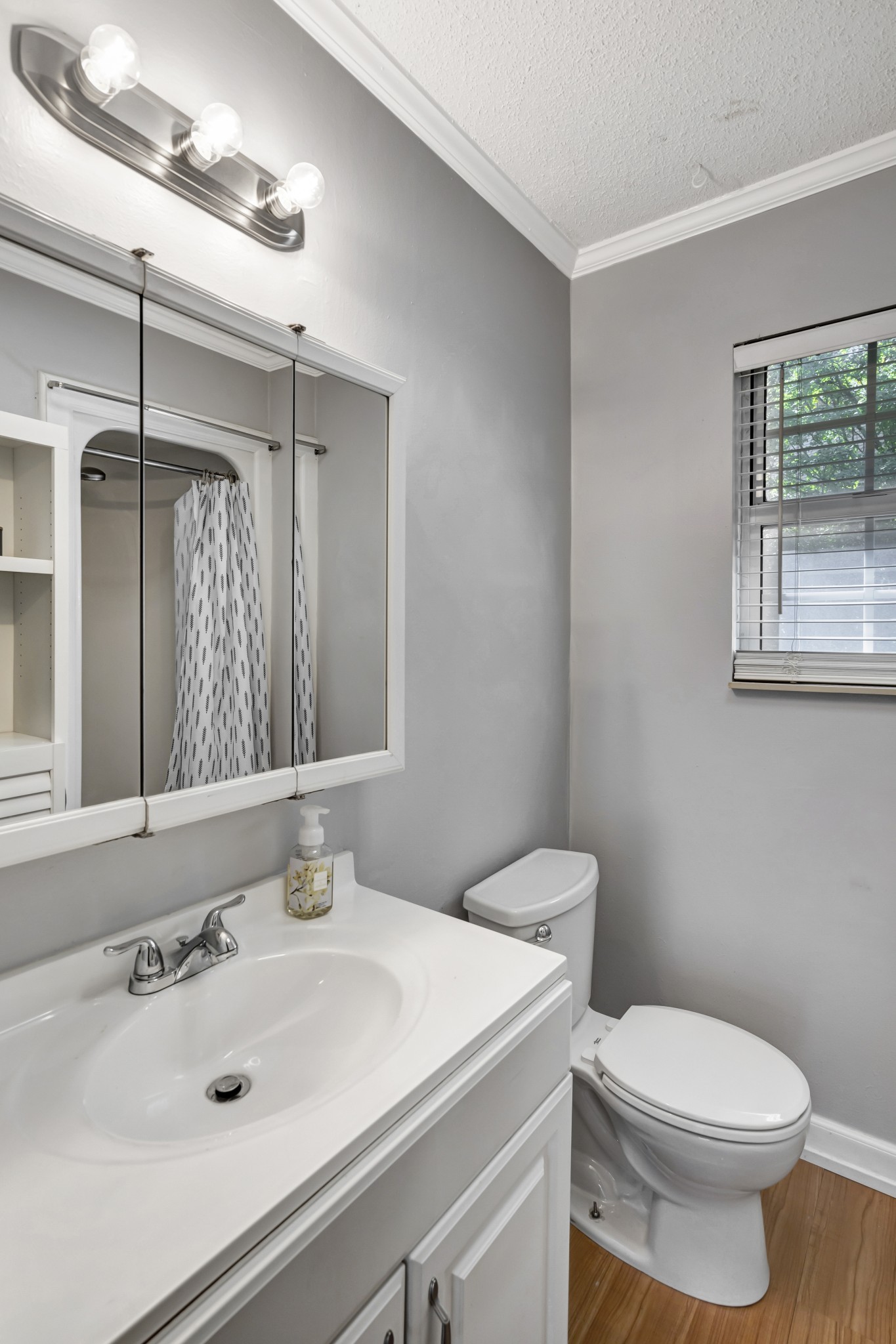 1060 Jacksons Valley Road Hermitage, TN 37076 - Photo 12 of 19 a bathroom with a sink toilet and shower