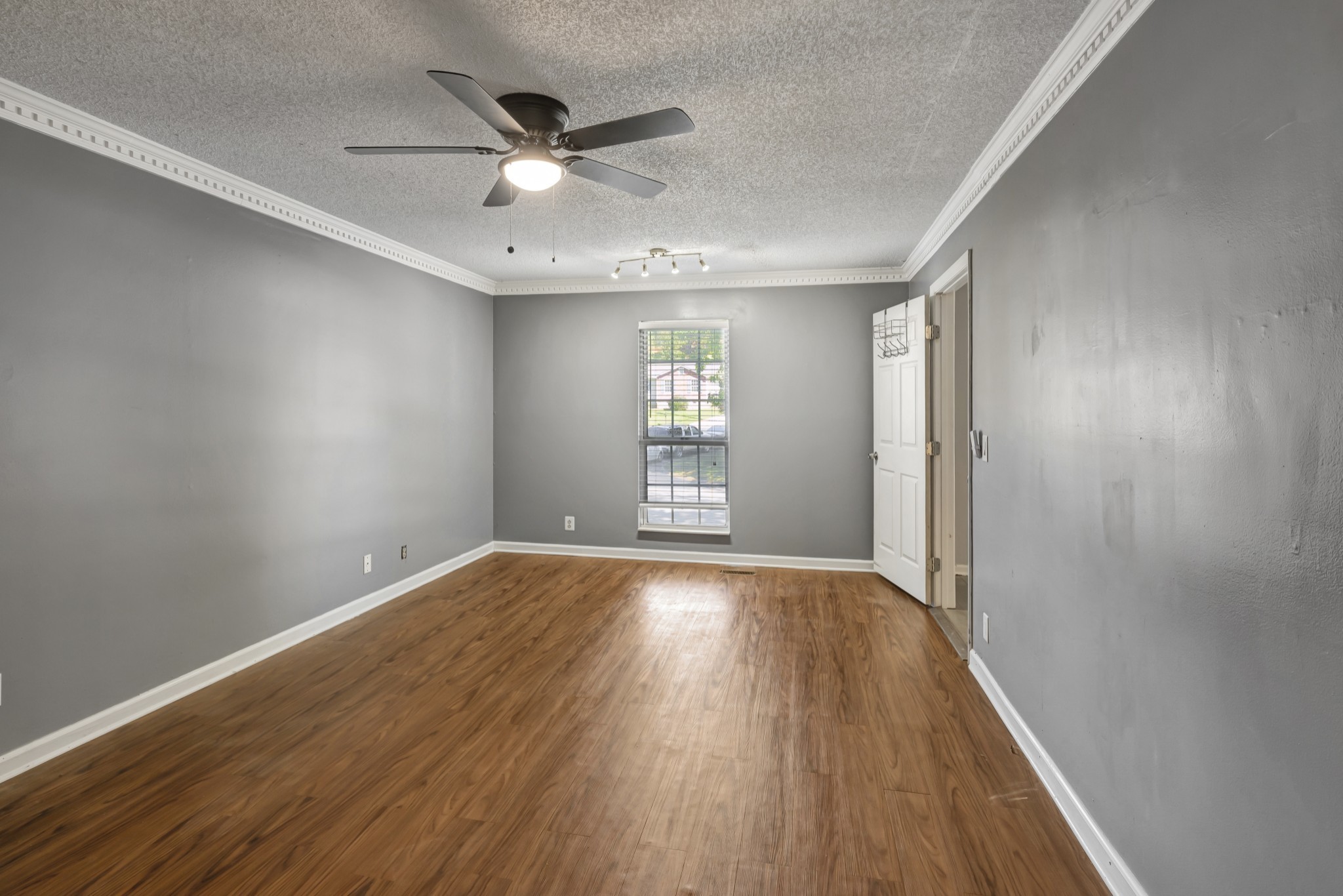 1060 Jacksons Valley Road Hermitage, TN 37076 - Photo 13 of 19 an empty room with wooden floor and windows