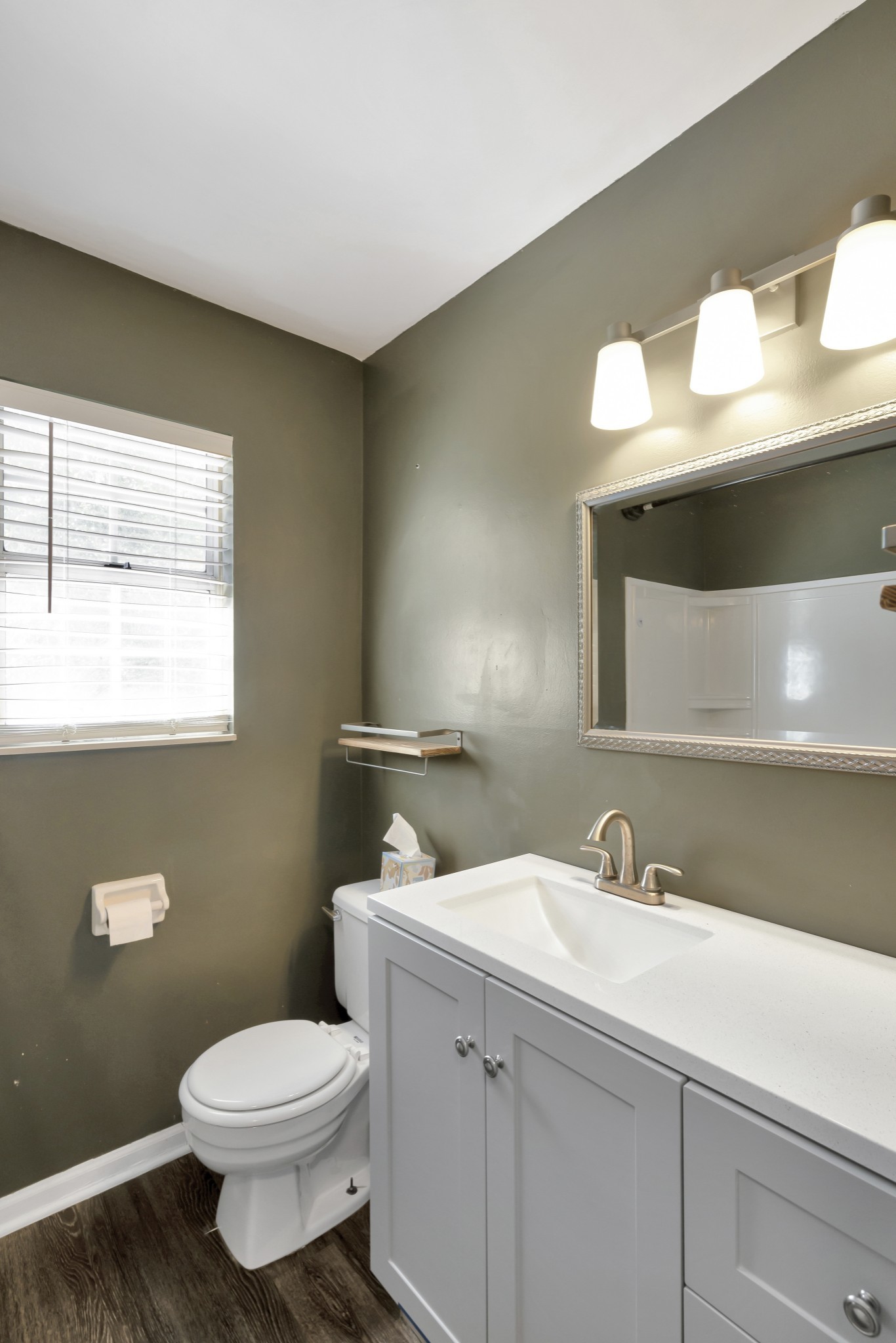 1060 Jacksons Valley Road Hermitage, TN 37076 - Photo 16 of 19 a bathroom with a toilet sink and mirror