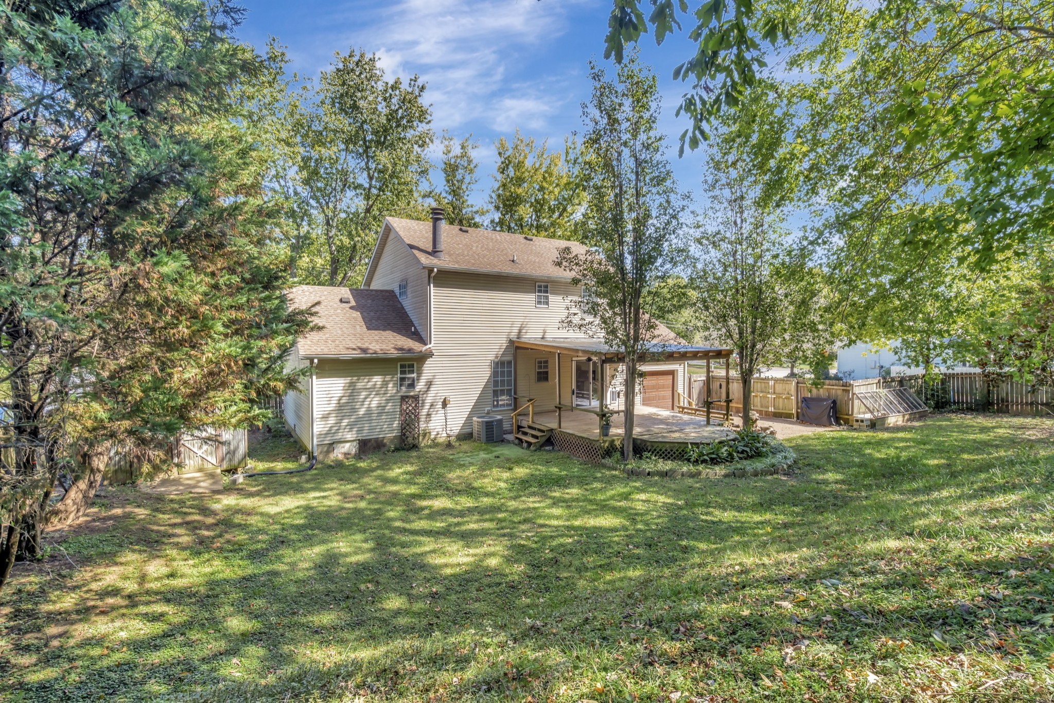 1060 Jacksons Valley Road Hermitage, TN 37076 - Photo 19 of 19 a white house that has a tree in front of the house
