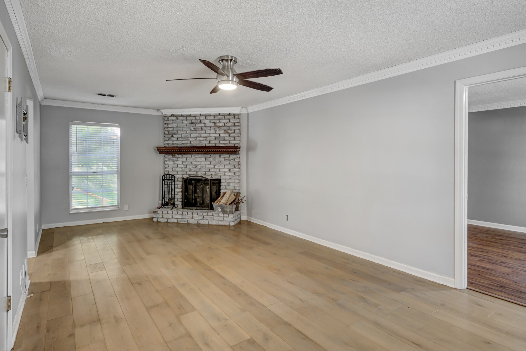 1060 Jacksons Valley Road Hermitage, TN 37076 - Photo 5 of 19 a view of empty room with fireplace and wooden floor