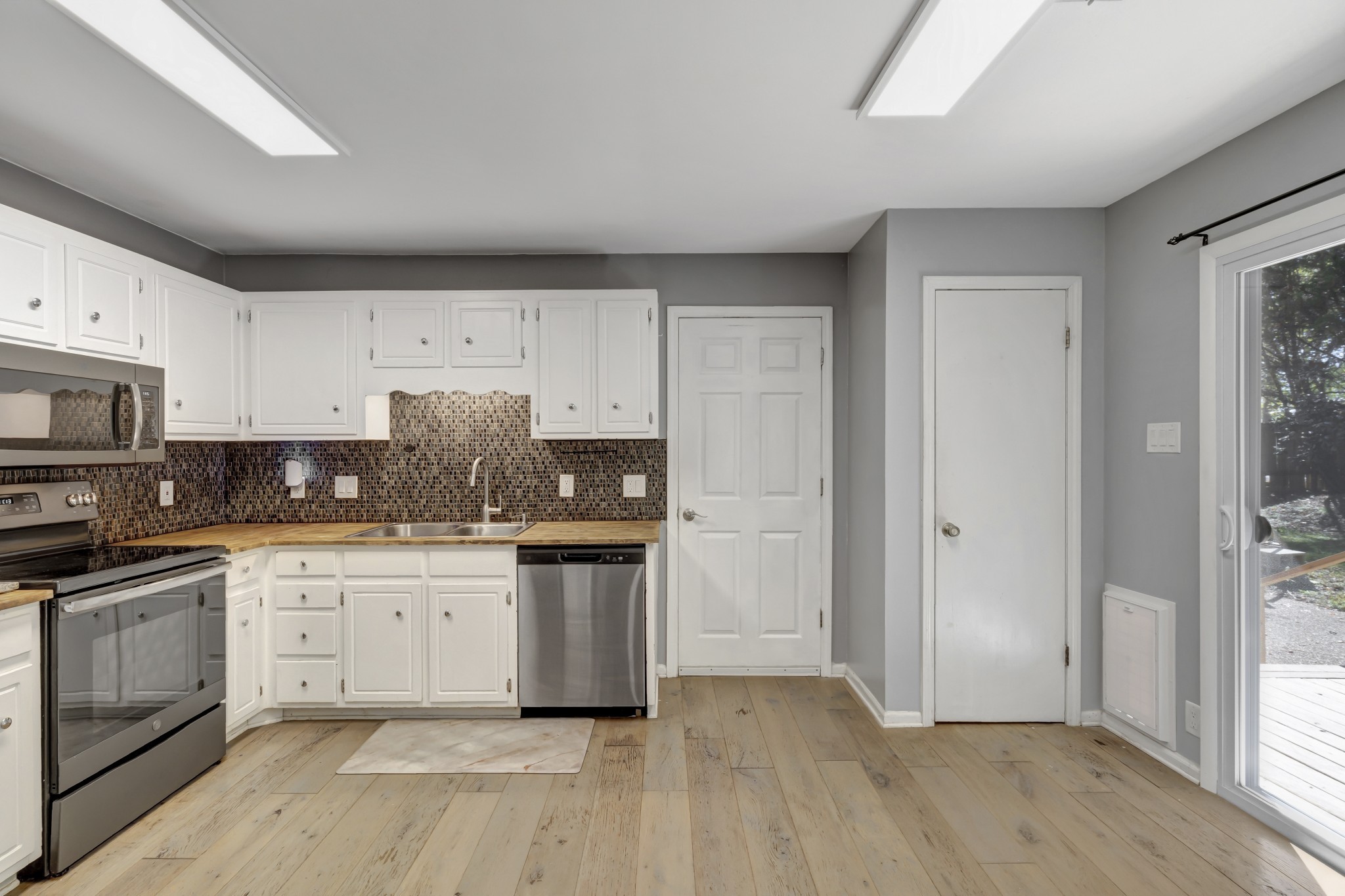1060 Jacksons Valley Road Hermitage, TN 37076 - Photo 6 of 19 a kitchen with stainless steel appliances granite countertop a stove a sink and a refrigerator