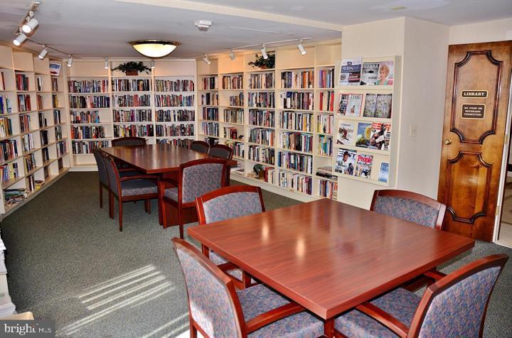 5225 Pooks Hill Road, Unit 120N Bethesda, MD 20814 - Photo 14 of 18 Cozy library filled with books and study tables.