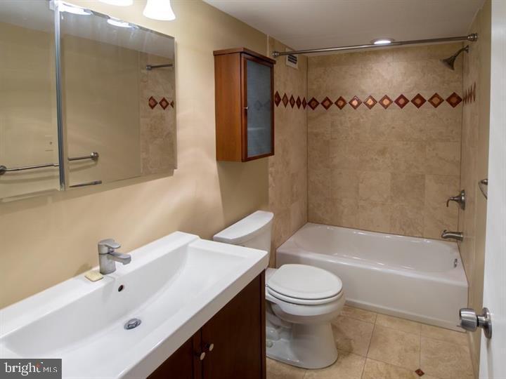 5225 Pooks Hill Road, Unit 120N Bethesda, MD 20814 - Photo 3 of 18 Modern bathroom with elegant tile accents.