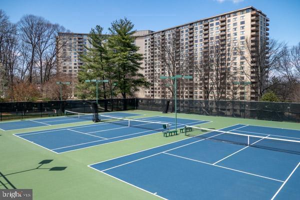 5225 Pooks Hill Road, Unit 120N Bethesda, MD 20814 - Photo 7 of 18 Vibrant tennis courts amidst urban living.