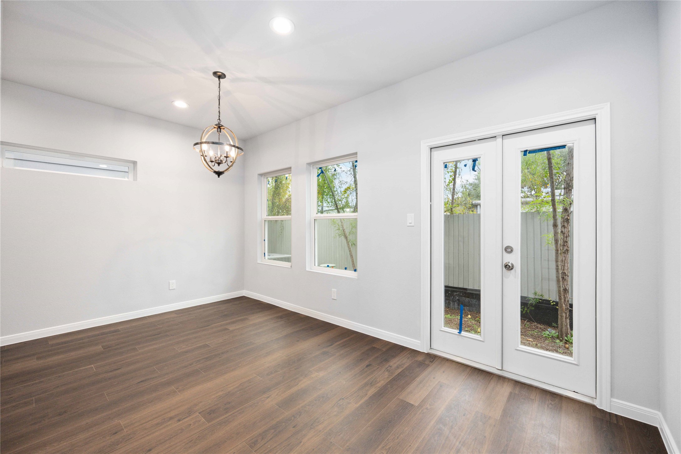 18831 Luminescent Ln Spring Spring, TX 77379 - Photo 13 of 36 a view of an empty room with wooden floor and a window