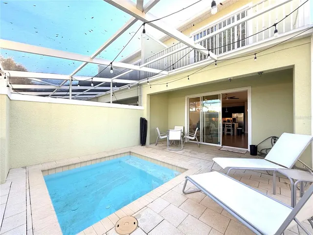 a view of a chairs and table in the patio
