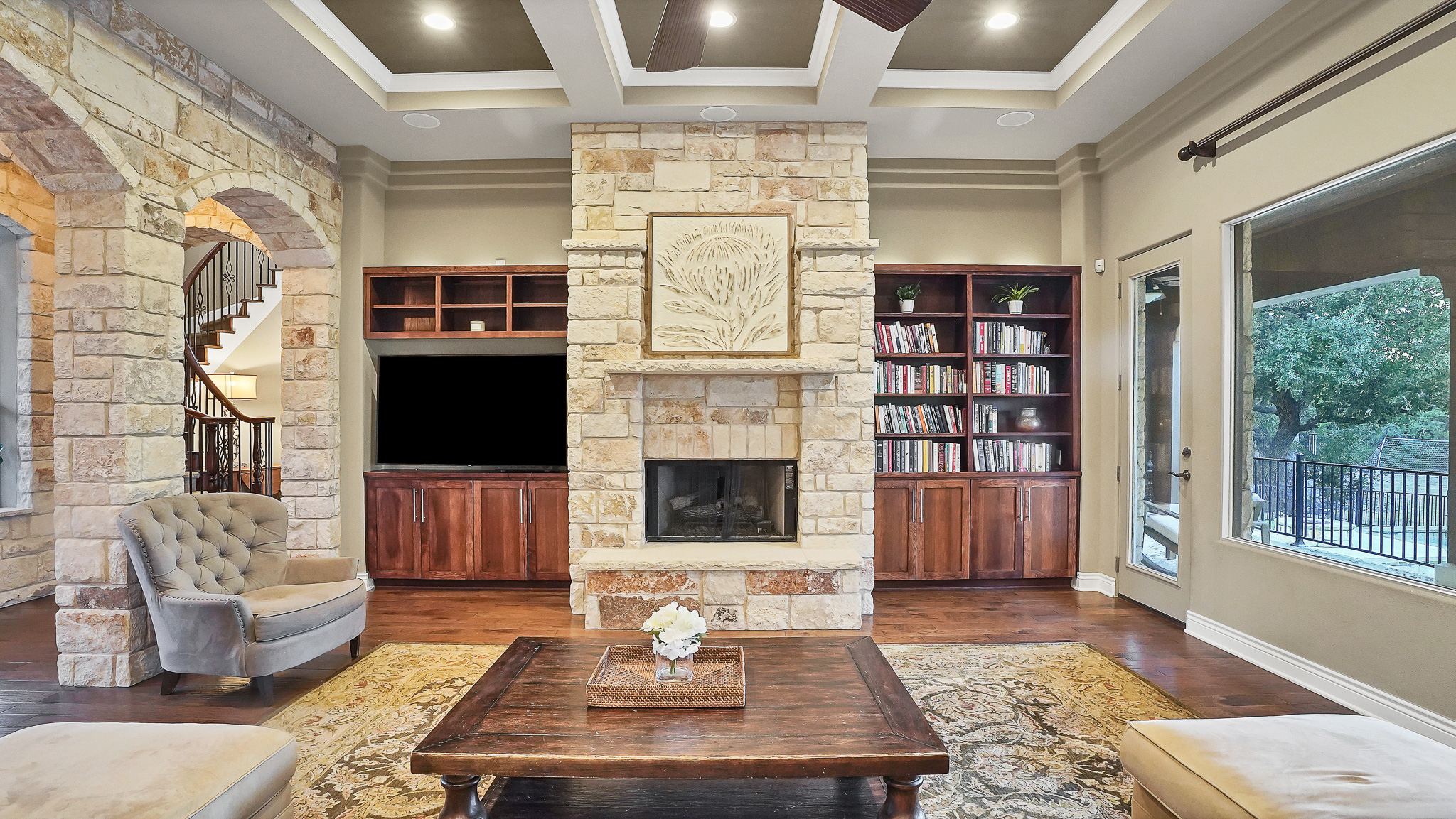 409 Escalera Parkway Georgetown, TX 78628 - Photo 12 of 40 a living room with furniture a flat screen tv and a fireplace