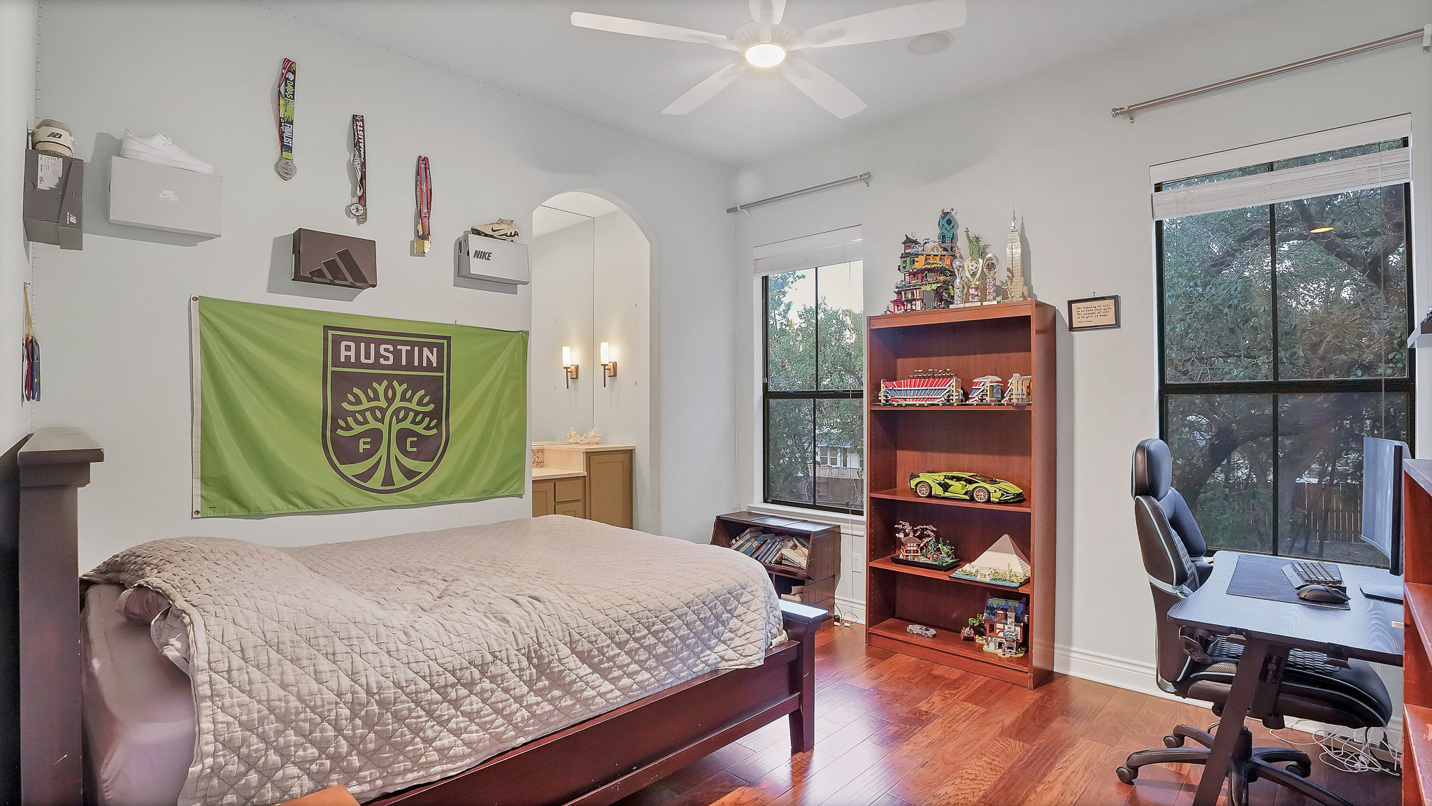 409 Escalera Parkway Georgetown, TX 78628 - Photo 14 of 40 a bed sitting in a bedroom next to a window