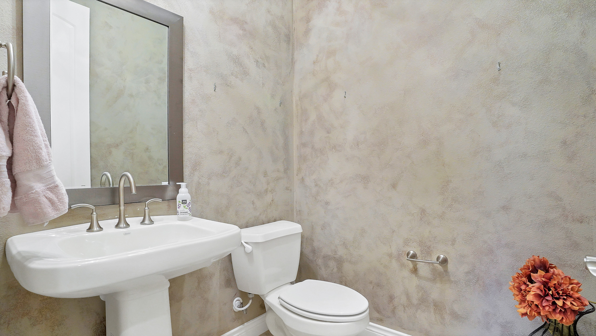 409 Escalera Parkway Georgetown, TX 78628 - Photo 18 of 40 a bathroom with a sink a toilet and mirror