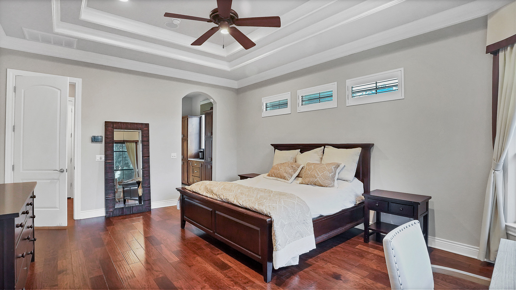 409 Escalera Parkway Georgetown, TX 78628 - Photo 22 of 40 a bedroom with a bed and a chandelier