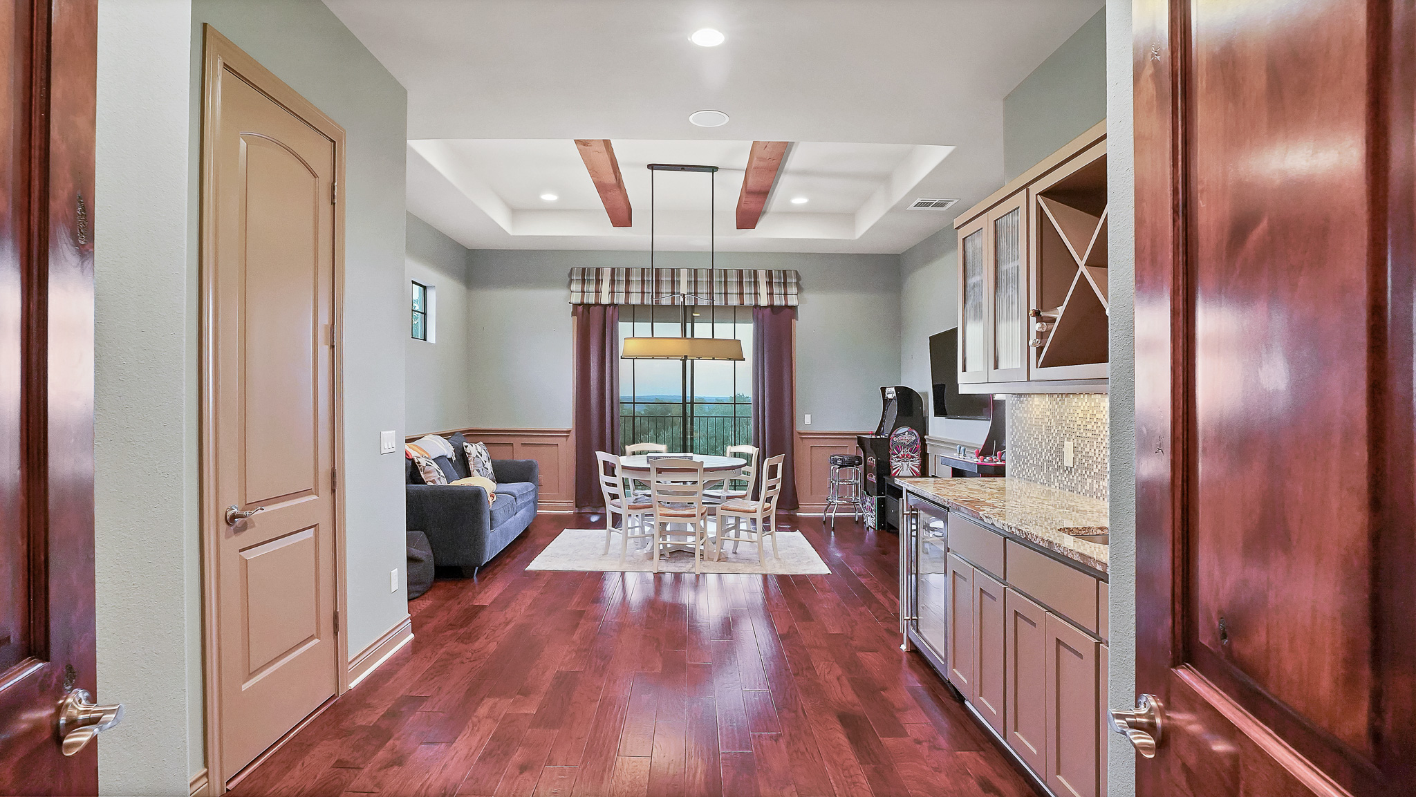 409 Escalera Parkway Georgetown, TX 78628 - Photo 27 of 40 a very nice looking room with wooden floor and furniture