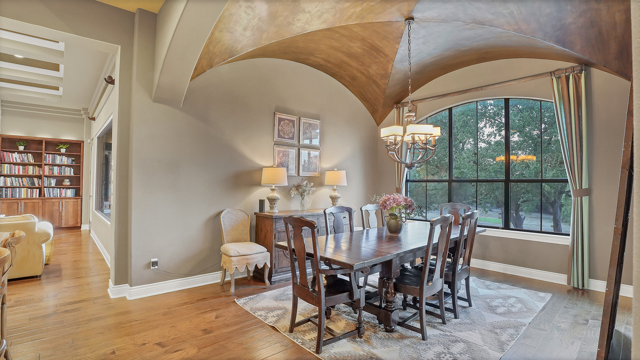 409 Escalera Parkway Georgetown, TX 78628 - Photo 9 of 40 a view of a dining room with furniture window and wooden floor
