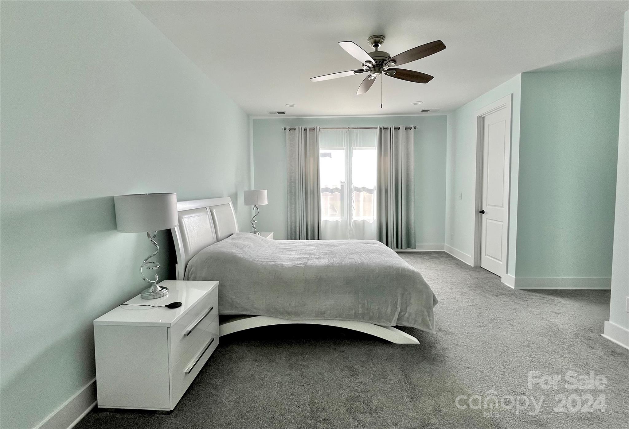 3117 Corinth Church Road Monroe, NC 28112 - Photo 17 of 30 a bedroom with a bed and a ceiling fan