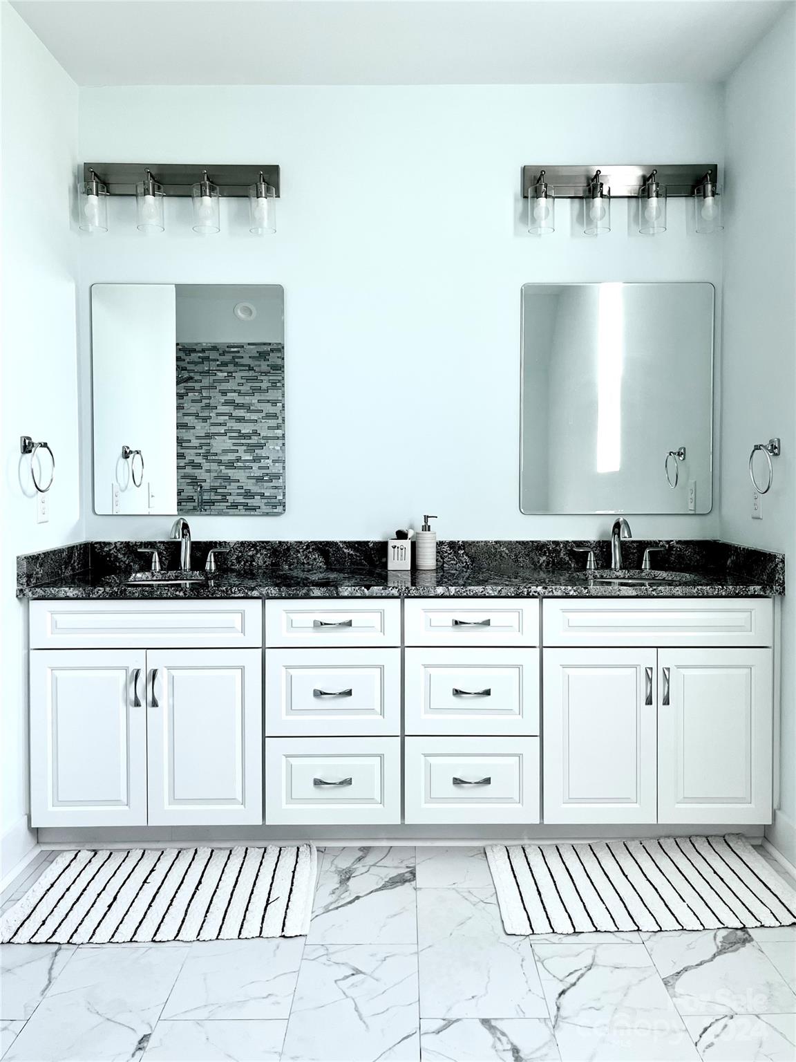 3117 Corinth Church Road Monroe, NC 28112 - Photo 21 of 30 a bathroom with a sink and a mirror