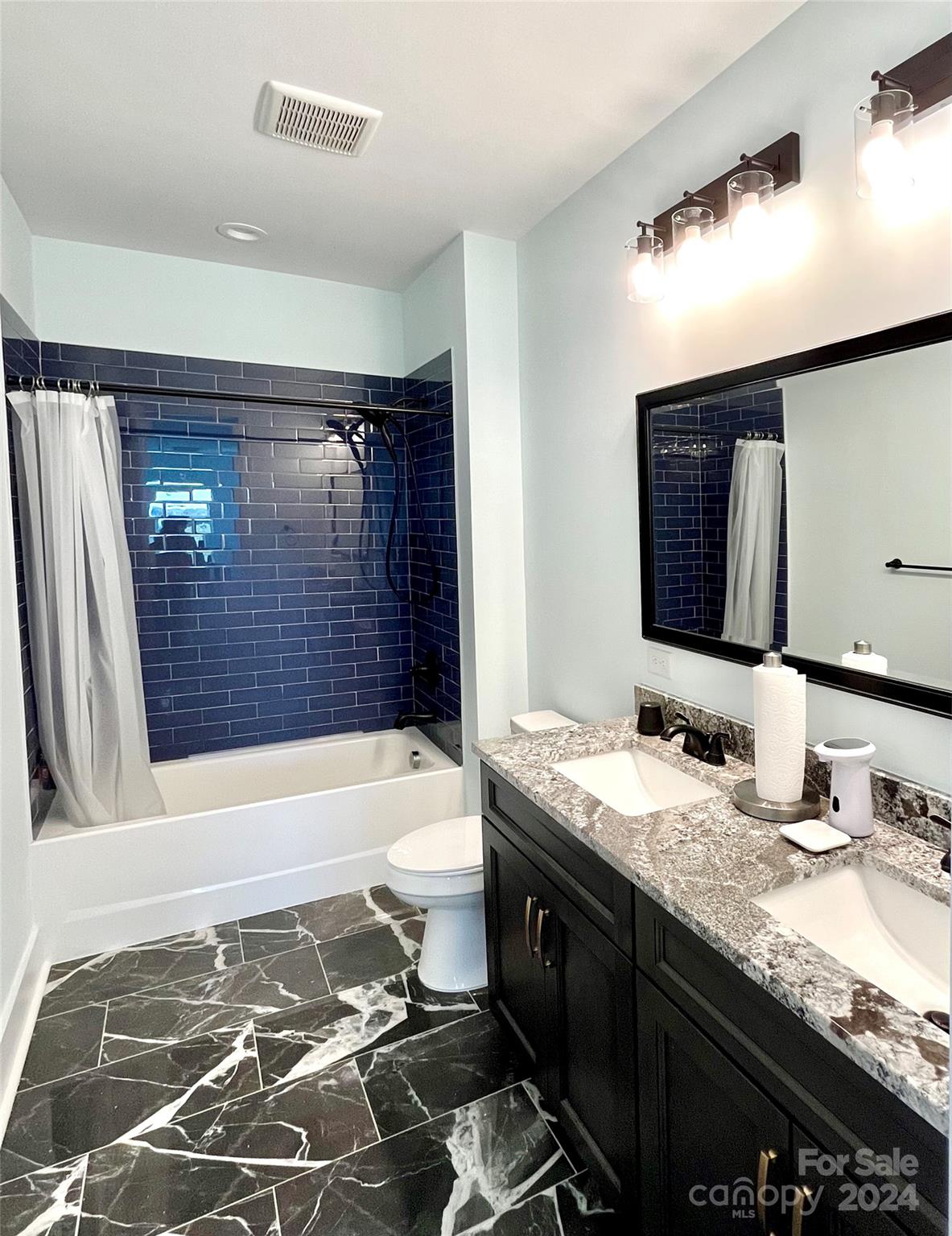 3117 Corinth Church Road Monroe, NC 28112 - Photo 25 of 30 a bathroom with a granite countertop sink toilet and shower