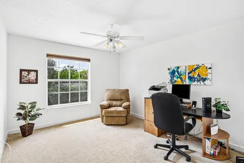 a work room with furniture and a window
