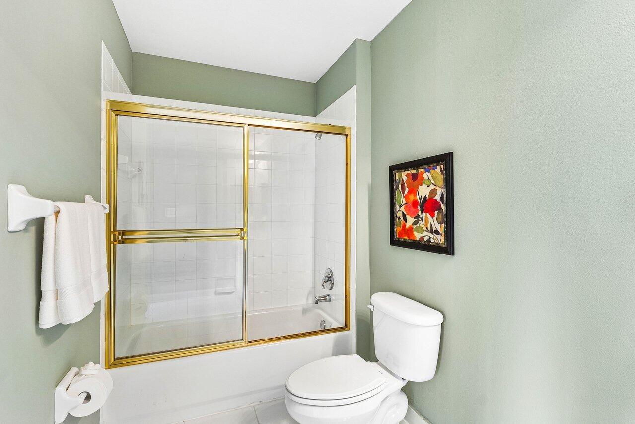 23069 Addison Lakes Circle Boca Raton, FL 33433 - Photo 18 of 26 a bathroom with a toilet and a shower