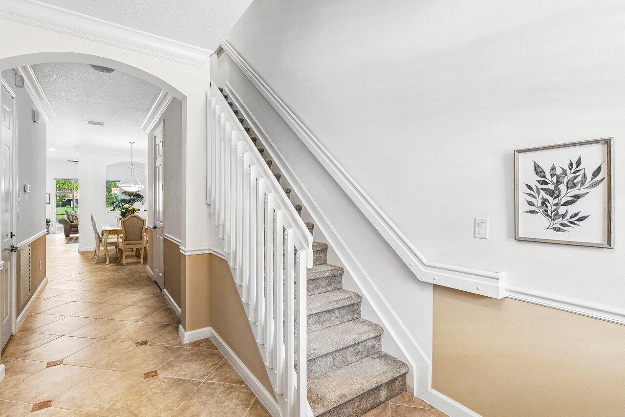 23069 Addison Lakes Circle Boca Raton, FL 33433 - Photo 2 of 26 a view of a hallway view with staircase
