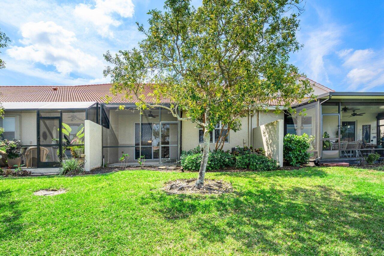 23069 Addison Lakes Circle Boca Raton, FL 33433 - Photo 21 of 26 a view of a house with a yard and sitting area