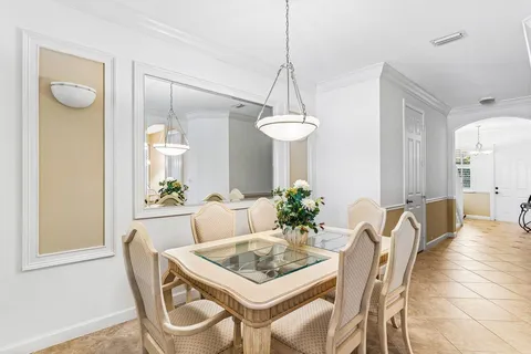 a dining room with furniture and window