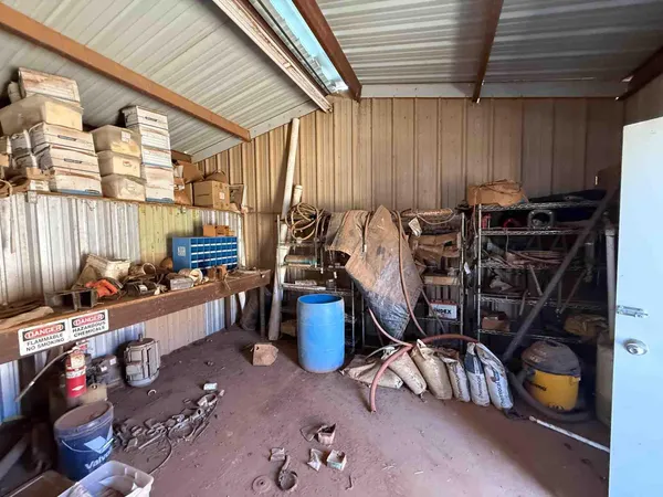 a kitchen with a refrigerator and a stove