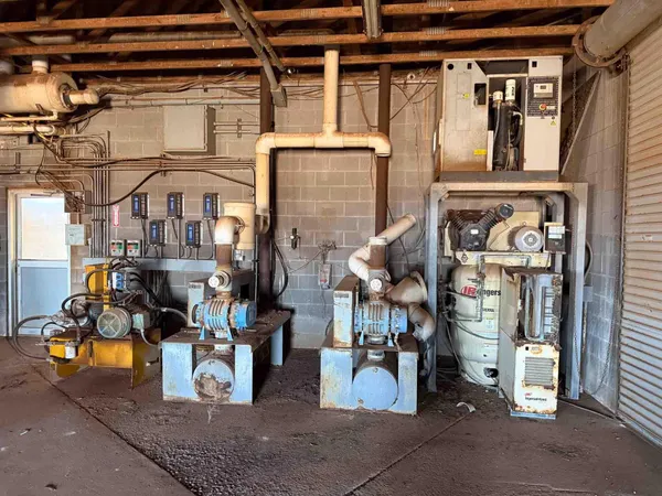 a front view of a building with sitting area